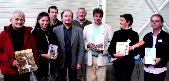 Photo des lauréats des Prix 2011 du Salon du Livre Pyrénéen de Bagnères-de-Bigorre De gauche à droite : Alain Bourneton, Marie-Laure Maraval, Jean-Bernard Sempastous (adjoint au maire de Bagnères), Robert Sablayrolles, Roland Castells (maire de Bagnères), Stéphane Lévêque (association Binaros), Raphaëlle Jessic, Sylvio Brianti (association Binaros). Absents : Patrice Poujade et Bernard Minier.